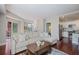 Spacious living room with hardwood floors, comfortable sofa, and view to the kitchen at 200 River Vista Dr # 423, Atlanta, GA 30339