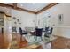 Community lounge area with ample seating, decorative art, and wooden beam ceiling accents at 200 River Vista Dr # 423, Atlanta, GA 30339