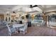 Covered outdoor patio with ample seating, ceiling fans, and views of the pool at 200 River Vista Dr # 423, Atlanta, GA 30339