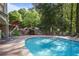 Inviting community pool with lounge chairs, rock waterfall, and beautiful landscaping at 200 River Vista Dr # 423, Atlanta, GA 30339