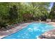 Community pool with lounge chairs and plenty of space for sunbathing or socializing at 200 River Vista Dr # 423, Atlanta, GA 30339