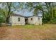 Back exterior view of the house, with a view of the yard at 3074 Delowe Dr, Atlanta, GA 30344