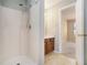 Bathroom featuring a shower, vanity with wooden cabinets, and doorway leading to a bedroom at 3455 Kingsbrooke Way, Decatur, GA 30034