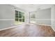 Bedroom with two large windows providing ample natural light and newly installed wood floors at 3455 Kingsbrooke Way, Decatur, GA 30034