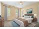 Comfortable bedroom with a large window, neutral walls, and ceiling fan at 3455 Kingsbrooke Way, Decatur, GA 30034