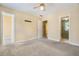 Open bedroom with multiple entryways, neutral walls, and ceiling fan at 3455 Kingsbrooke Way, Decatur, GA 30034