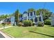 Inviting two-story home with a manicured lawn and an attached garage on a sunny day at 3455 Kingsbrooke Way, Decatur, GA 30034