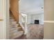Open-concept living area with a staircase and a cozy fireplace, perfect for entertaining at 3455 Kingsbrooke Way, Decatur, GA 30034