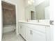 Bright bathroom features dual sinks with modern fixtures and a tiled shower and tub at 3495 Delegate Aly, Scottdale, GA 30079