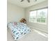 Bedroom featuring light from a large window, a dinosaur-themed bed, and a bookshelf at 3495 Delegate Aly, Scottdale, GA 30079