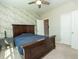 Comfortable bedroom with ceiling fan, neutral carpet, and a large window with natural light at 3495 Delegate Aly, Scottdale, GA 30079