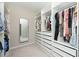 Well-organized walk-in closet features custom shelving and plenty of hanging space at 3495 Delegate Aly, Scottdale, GA 30079