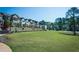 Well-maintained community with manicured lawns and a stone wall at 3495 Delegate Aly, Scottdale, GA 30079