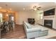 Bright and open living room with a fireplace, piano, and access to the kitchen area at 3495 Delegate Aly, Scottdale, GA 30079