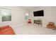 Living room features a large TV, a small storage shelf, and two large windows at 3495 Delegate Aly, Scottdale, GA 30079