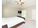 This is a bright, spacious main bedroom with a trey ceiling and a ceiling fan at 3495 Delegate Aly, Scottdale, GA 30079
