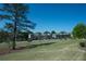Beautiful neighborhood showcasing a green lawn, mature trees, and well-kept homes at 3495 Delegate Aly, Scottdale, GA 30079