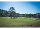 Picturesque view of a serene neighborhood with mature trees and manicured lawns at 3495 Delegate Aly, Scottdale, GA 30079