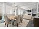 Bright dining area featuring designer chandelier, seating for six, and an open-concept layout at 74 Academy St, Alpharetta, GA 30009
