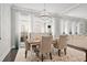 Bright dining area featuring designer chandelier, seating for six, and an open-concept layout at 74 Academy St, Alpharetta, GA 30009