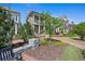 Lovely landscaped front yard with brick walkway leading to a beautifully designed two-story home with welcoming curb appeal at 74 Academy St, Alpharetta, GA 30009