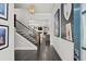 Welcoming foyer features hardwood floors, elegant staircase, and stylish decor at 74 Academy St, Alpharetta, GA 30009