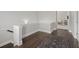 Upstairs hallway features wood floors, white trim, and an ornate area rug at the staircase landing at 74 Academy St, Alpharetta, GA 30009