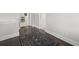 Hallway design includes dark wood floors, a classic area rug, and neutral wall paint at 74 Academy St, Alpharetta, GA 30009
