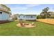 Large backyard with a fire pit and space for outdoor seating at 2374 Marion Cir, Decatur, GA 30032