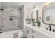 Contemporary bathroom with double vanity, sleek fixtures, and a tiled shower at 2374 Marion Cir, Decatur, GA 30032