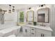 Bright bathroom featuring double sink vanity with white cabinets and modern gold fixtures at 2374 Marion Cir, Decatur, GA 30032