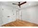 Bright bedroom with hardwood floors, a modern ceiling fan, and closet at 2374 Marion Cir, Decatur, GA 30032