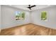 Bedroom featuring hardwood floors and bright windows offering pleasant outdoor views at 2374 Marion Cir, Decatur, GA 30032