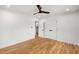 A bright bedroom features a modern ceiling fan, and hardwood floors at 2374 Marion Cir, Decatur, GA 30032