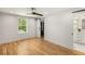Bedroom featuring hardwood floors, a barn door to closet, and ensuite bathroom at 2374 Marion Cir, Decatur, GA 30032