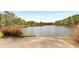 A boat ramp leads into the serene Buena Vista Lake, surrounded by grassy banks at 2374 Marion Cir, Decatur, GA 30032