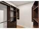 Walk-in closet featuring custom shelves, drawers, and rods for optimal organization at 2374 Marion Cir, Decatur, GA 30032