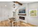 Cozy dining room with a modern fireplace, wooden table, and ample natural light, perfect for Gathering meals at 2374 Marion Cir, Decatur, GA 30032