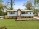 Charming light blue home with lovely landscaping and craftsman details; beautiful and well maintained at 2374 Marion Cir, Decatur, GA 30032