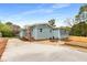 Charming home with a driveway, a small porch, and an outdoor seating area at 2374 Marion Cir, Decatur, GA 30032