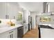 Bright kitchen features white cabinets, stainless steel appliances, and a subway tile backsplash at 2374 Marion Cir, Decatur, GA 30032