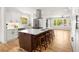 Well-lit kitchen with a large island, stainless steel appliances, and ample cabinet space at 2374 Marion Cir, Decatur, GA 30032