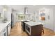 Spacious kitchen with stainless appliances, central island, and modern white cabinetry at 2374 Marion Cir, Decatur, GA 30032