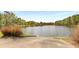 Peaceful lake access with a concrete boat ramp and lush greenery at 2374 Marion Cir, Decatur, GA 30032