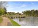 View of a wooden dock and pathway with covered shelter extending into Buena Vista Lake at 2374 Marion Cir, Decatur, GA 30032