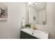 Stylish powder room with modern vanity, decorative mirror, and elegant fixtures at 2374 Marion Cir, Decatur, GA 30032