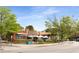 Corner restaurant location with lush green trees, covered patio seating, and clear street access in a neighborhood setting at 2374 Marion Cir, Decatur, GA 30032