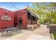 Red brick bar and restaurant with outdoor seating, sidewalk access, and vintage signage at 2374 Marion Cir, Decatur, GA 30032