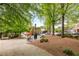 Scenic view of a town square park under mature trees with benches and bike rack at 2374 Marion Cir, Decatur, GA 30032