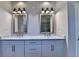 Elegant bathroom featuring a double sink vanity with marble countertop, framed mirrors and a glimpse of the glass shower at 3237 Birkdale Ave, Duluth, GA 30097
